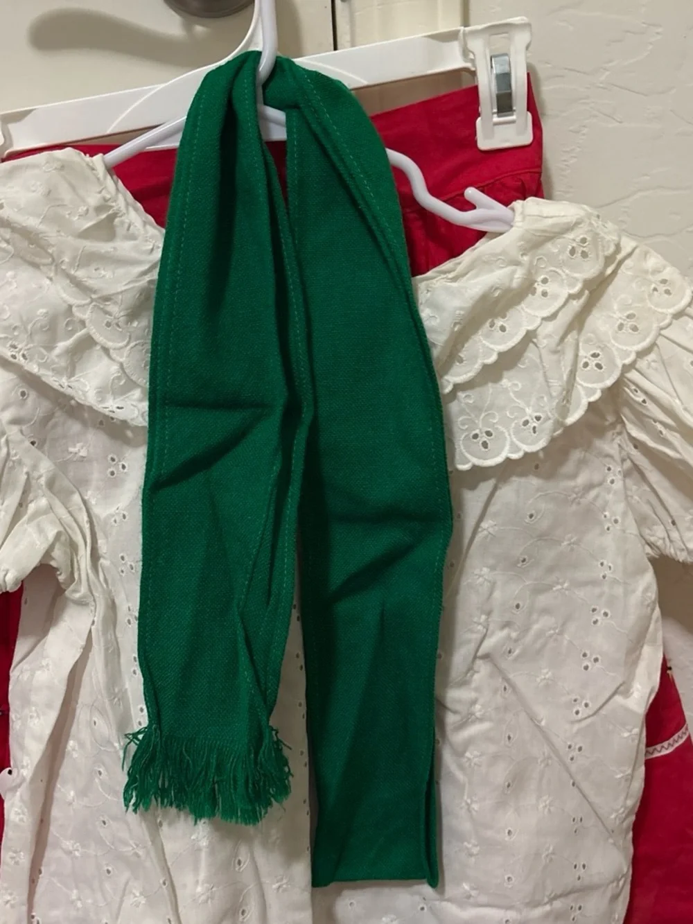 Folclórico Red skirt with white polka dots and green trim, with a white top and